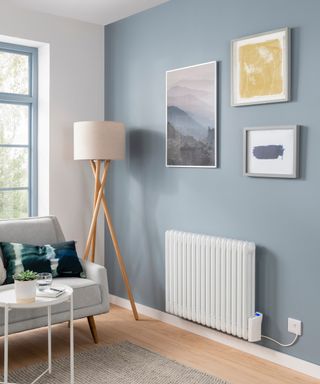 A light blue living room with modern floor lamp and white radiator