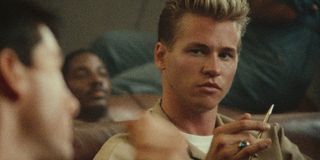 Val Kilmer fiddles with his pen annoyed in class in Top Gun.