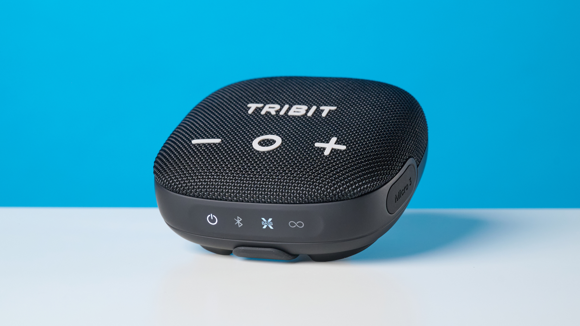 Tribit StormBox Micro 3 in black photographed in front of a blue background