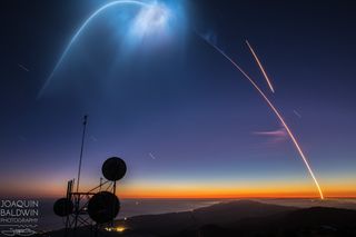 Photographer Joaquin Baldwin captured this spectacular image of SpaceX's successful Falcon 9 rocket launch and landing at Vandenberg Air Force Base in California on Oct. 7, 2018. The streak at top right is the Falcon 9 first stage returning to Earth.