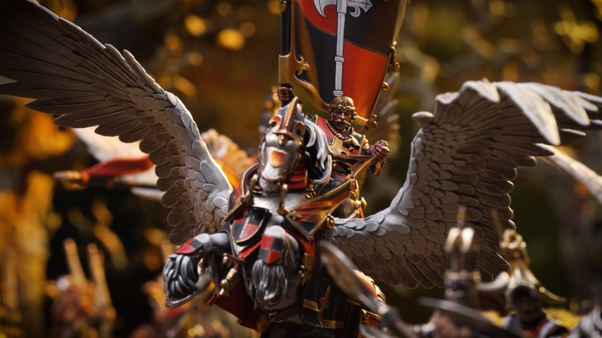 A standard bearer lifts their flag while riding a pegasus