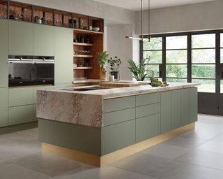 Kitchen Feng Shui with green cabinets and island with stove