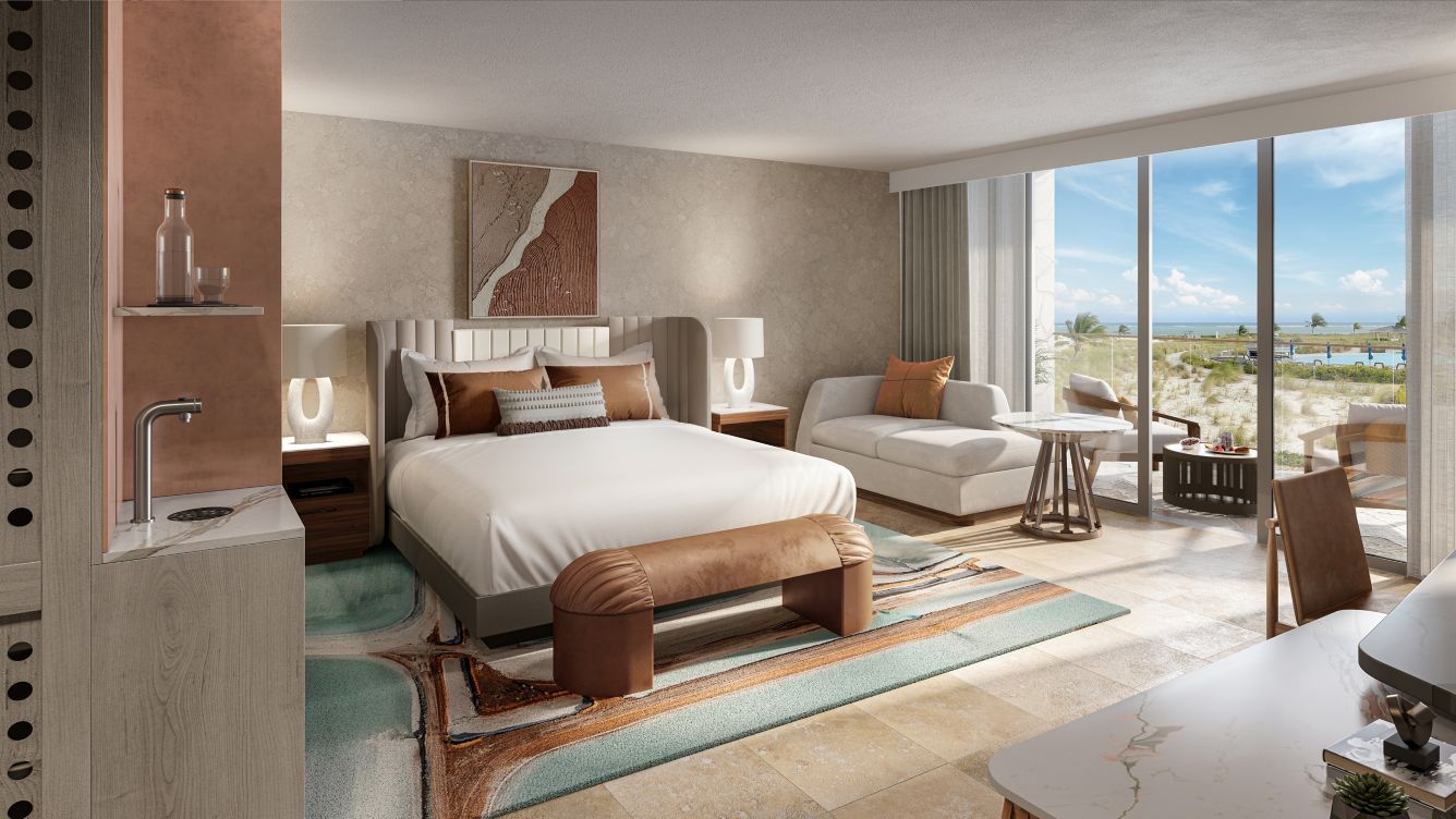 A rendering of a large room at Salterra hotel in Turks & Caicos with a sink and king-size bed and views of the beach outside