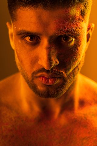 A portrait of a male wrestler looking at the camera