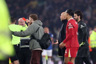 LIVERPOOL, ENGLAND - FEBRUARY 12: Arne Slot, Manger of Liverpool, is shown a red card by referee Michael Oliver at the end of the Premier League match between Everton FC and Liverpool FC at Goodison Park on February 12, 2025 in Liverpool, England. (Photo by Carl Recine/Getty Images)