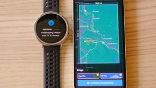 Close up of the Amazfit Active 2 smartwatch next to a smartphone showing the process for downloading and saving an offline map