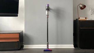 Dyson Micro 1.5kg leaning against a wall