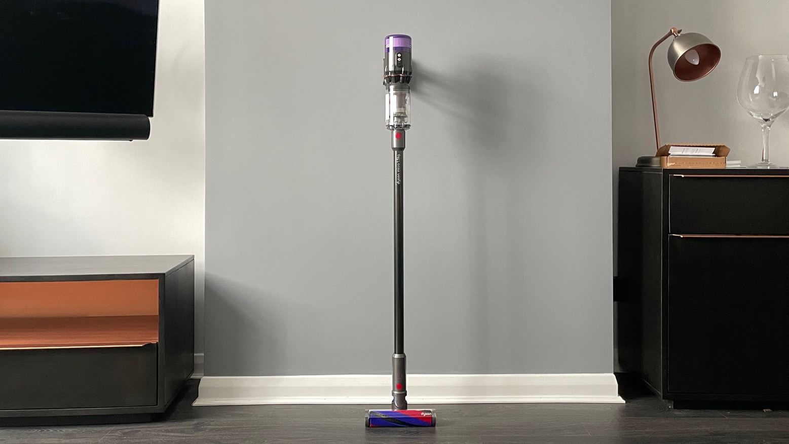 Dyson Micro 1.5kg leaning against a wall