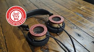 Grado headphones on table with Deals of the Week logo
