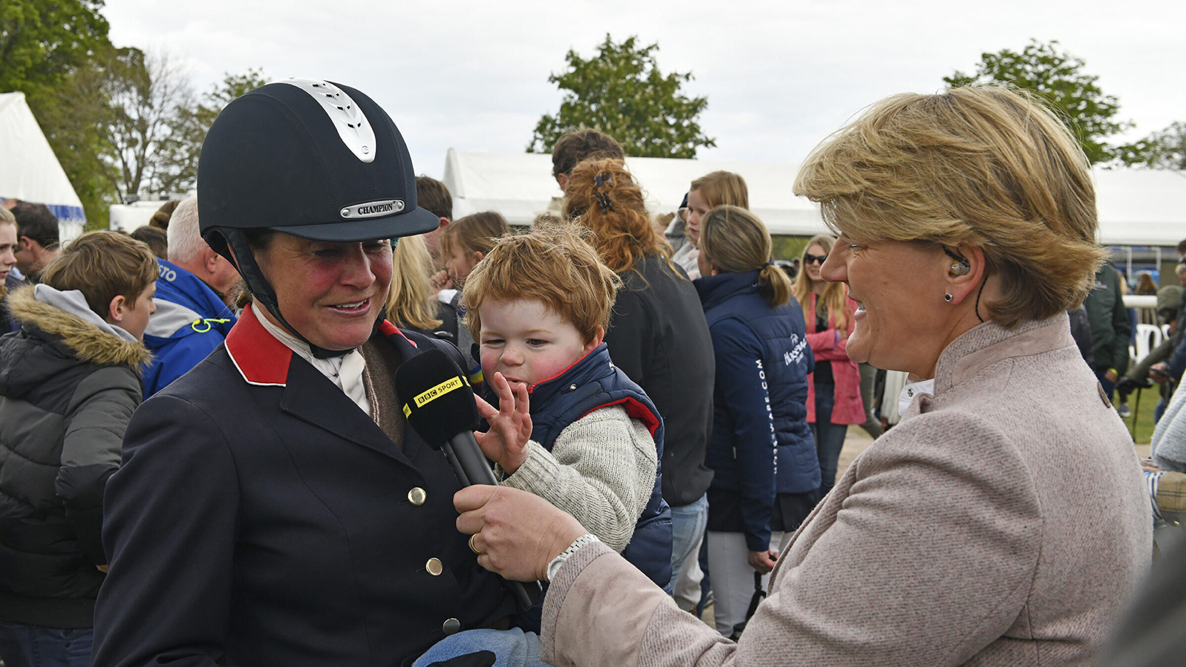 Piggy March being interviewed at Badminton Horse Trials by Claire Balding with son in her arms