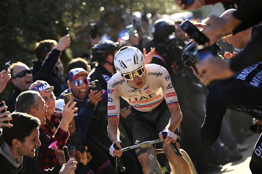 SIENA, ITALY - MARCH 02: Race winner Tadej Pogacar of Slovenia and UAE Team Emirates competes while fans cheer during the 18th Strade Bianche 2024, Men&#039;s Elite a 215km one day race from Siena to Siena 320m / #UCIWT / on March 02, 2024 in Siena, Italy. (Photo by Fabio Ferrari - Pool/Getty Images)