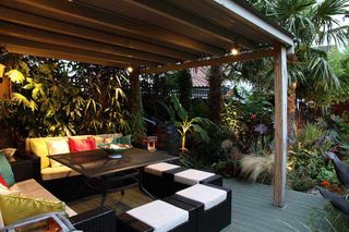 carribean seating area under a tin roof