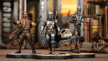 The Mandalorian, Grogu, Greef Karga, and IG-11 models on a Star Wars: Shatterpoint battlefield