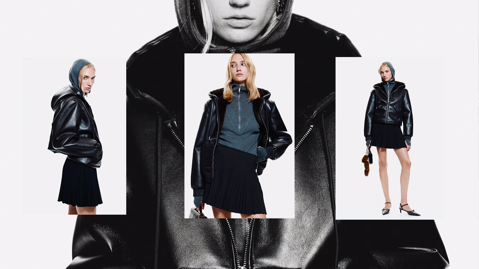 The model wears a black faux leather hooded jacket with a zipper, gray quarter zip inside the hoodie, and a pleated mini skirt with studded pointed-toe heels