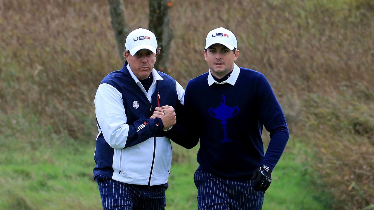 Phil Mickelson and Keegan Bradley shake hands at the 2014 Ryder Cup