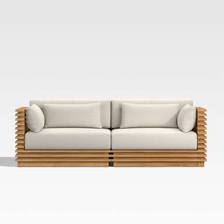 An outdoor sofa with teak base