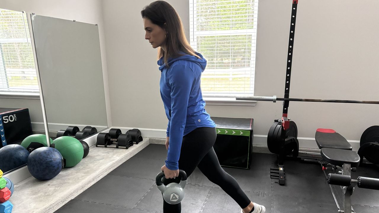Tami Smith demonstrates a reverse lunge