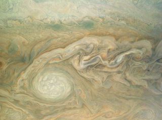 Jupiter's Little Red Spot takes center stage in this enhanced color photo from NASA's Juno spacecraft in orbit around the planet. The image was taken Feb. 2, 2017 (and released May 18) and was processed by citizen scientist Bjorn Jonsson using data from J