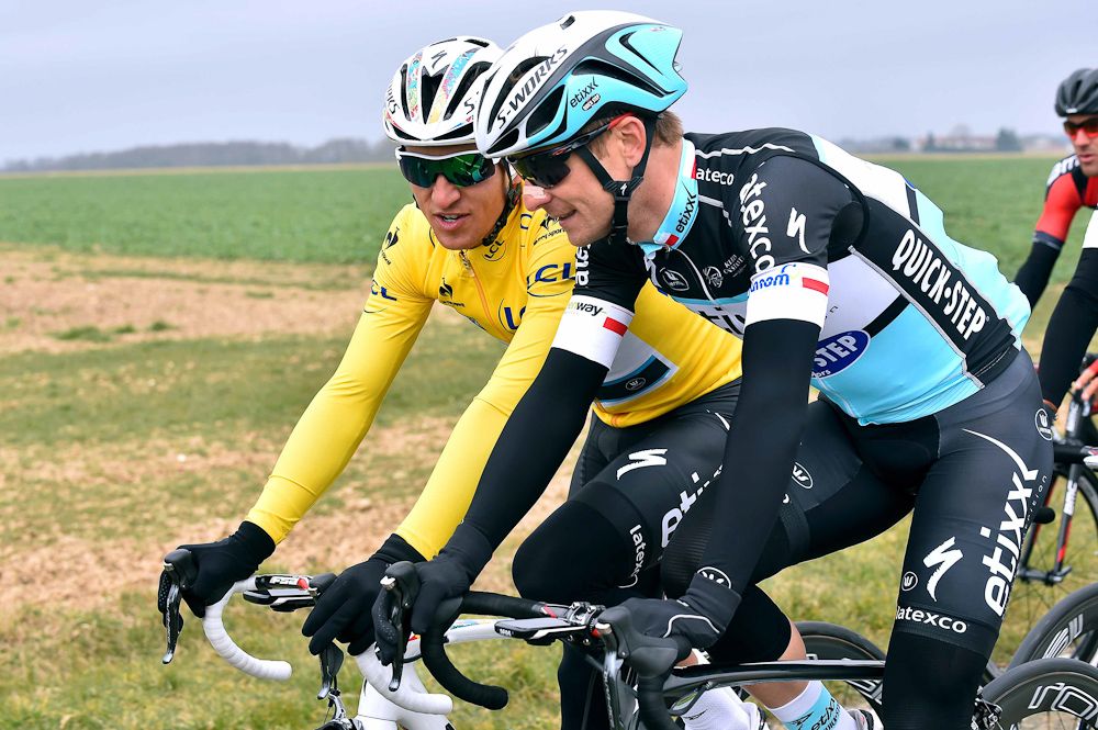 Kwiatkowski in yellow talks with countryman and teammate Michal Golas.