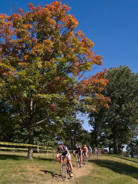 Rebecca Wellons (Team Plan C) leads the women&rsquo;s field past a scenic view on the opening lap.