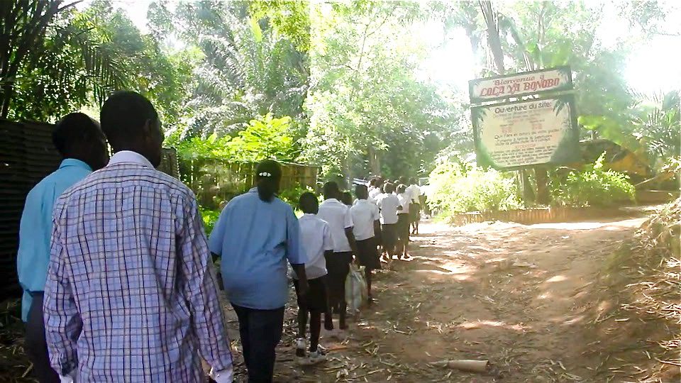 Congolese line up to enter a bonobo sanctuary in the Congo.