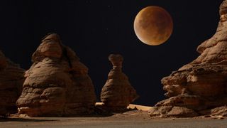This composite image shows a blood moon lunar eclipse as seen in London and the Acacus mountains in the Libyan desert.