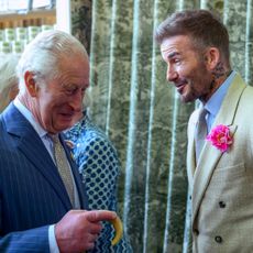 David Beckham talking and laughing to King Charles