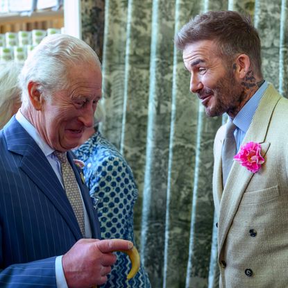 David Beckham talking and laughing to King Charles