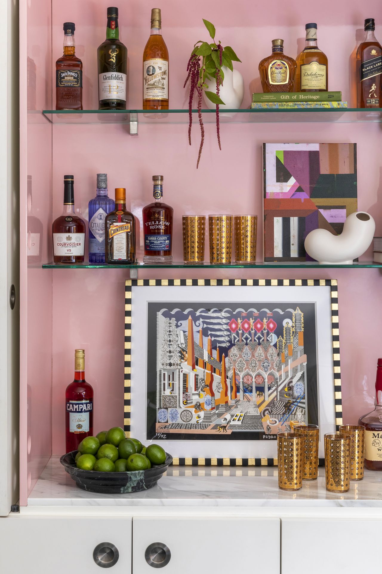 A pink toned bar storage unit inside a living room
