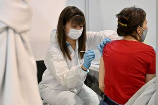Woman receiving Covid-19 vaccine