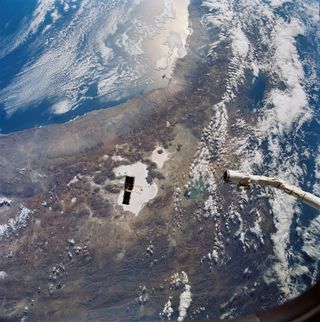 The Hubble Space Telescope drifting away from the space shuttle Discovery over South America on April 25, 1990.