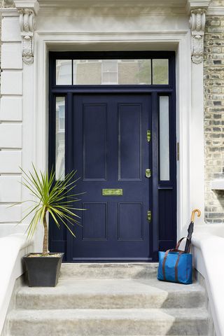 Georgian front door with limestone threshold and navy blue door