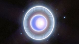 a bright white and blue orb surrounded by bright white rings and dots of light
