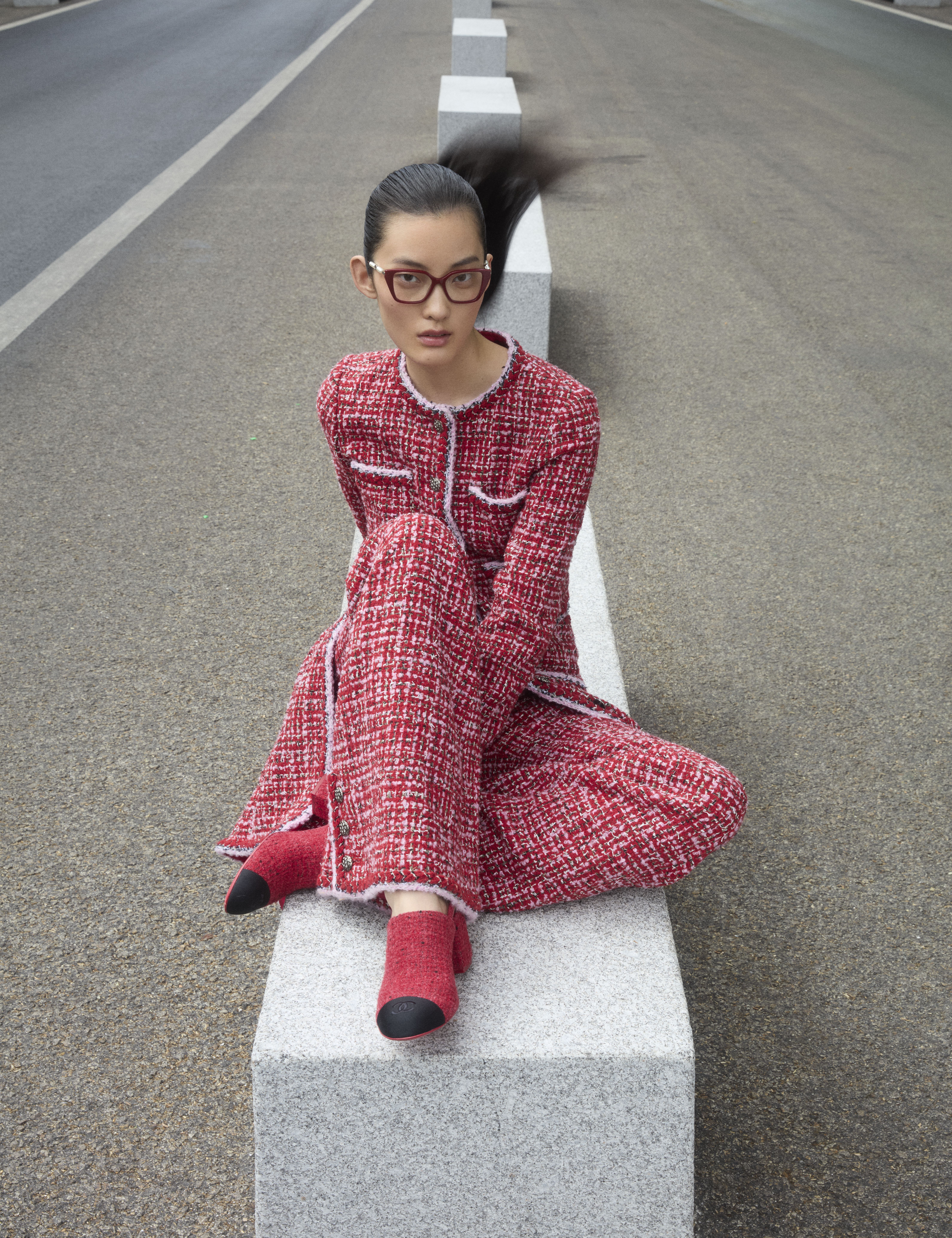 a model on the streets of paris wearing designs from the autumn/winter 2025 collections