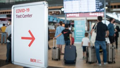 A sign pointing to a test centre at the Berlin Brandenburg Airport, pictured on 28 July 2021