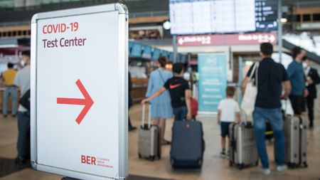 A sign pointing to a test centre at the Berlin Brandenburg Airport, pictured on 28 July 2021