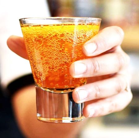 Drink, Alcohol, Alcoholic beverage, Distilled beverage, Beer cocktail, Juice, Liqueur, Beer glass, Cocktail, Hand, 