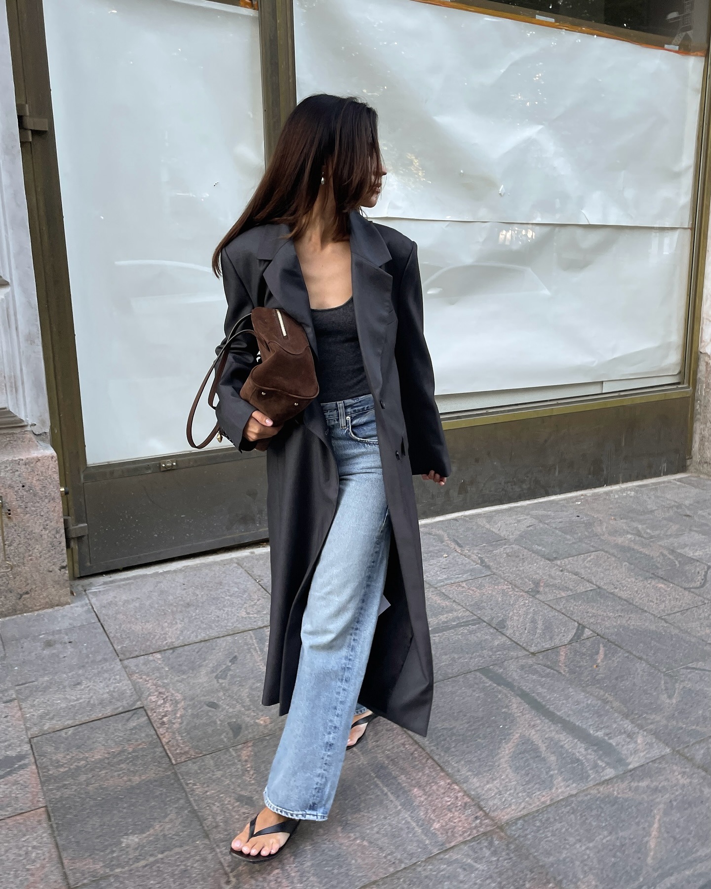 Woman in long coat and jeans