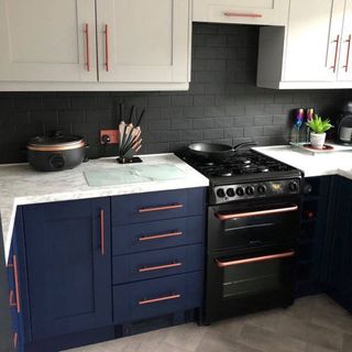 kitchen with cabinets and dark blue paint