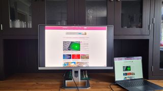 InnoCN 27M2U Mini LED monitor in a home office next to a connected laptop