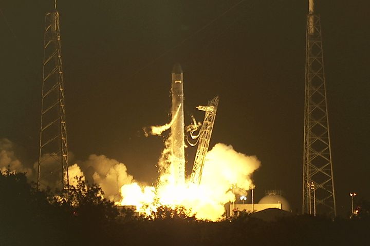A SpaceX Falcon 9 rocket launches the company's Dragon cargo capsule on a demonstration mission to the International Space Station on May 22, 2012.