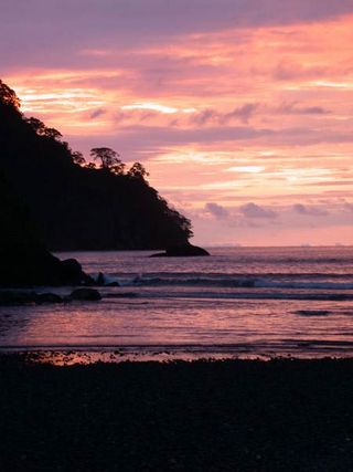 Sunset in the Pacific: Cocos Island is uninhabited, but the waters that surrounded the tiny island are rich with a dazzling array of ocean life.