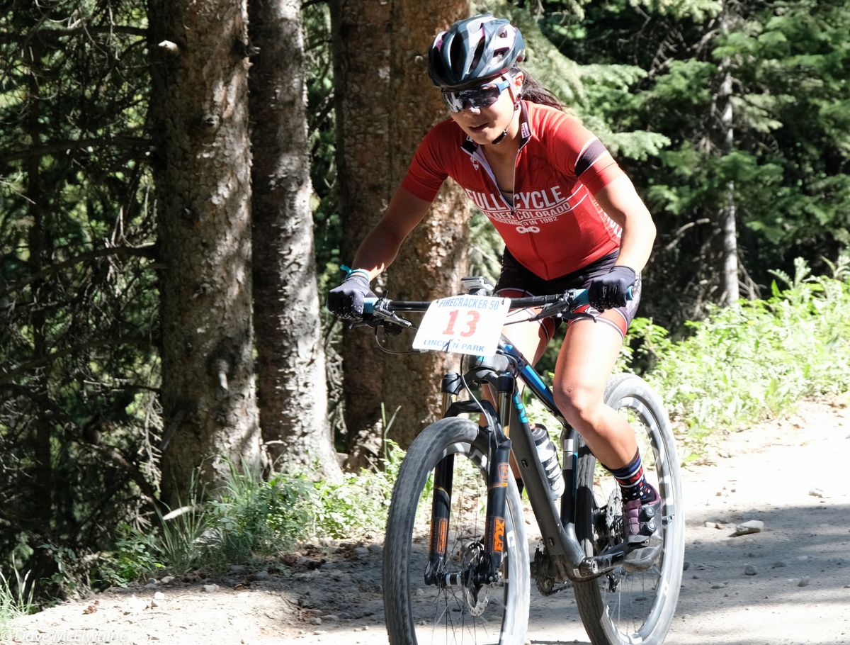 Evelyn Dong (Full Cycle) riding in third place during lap one