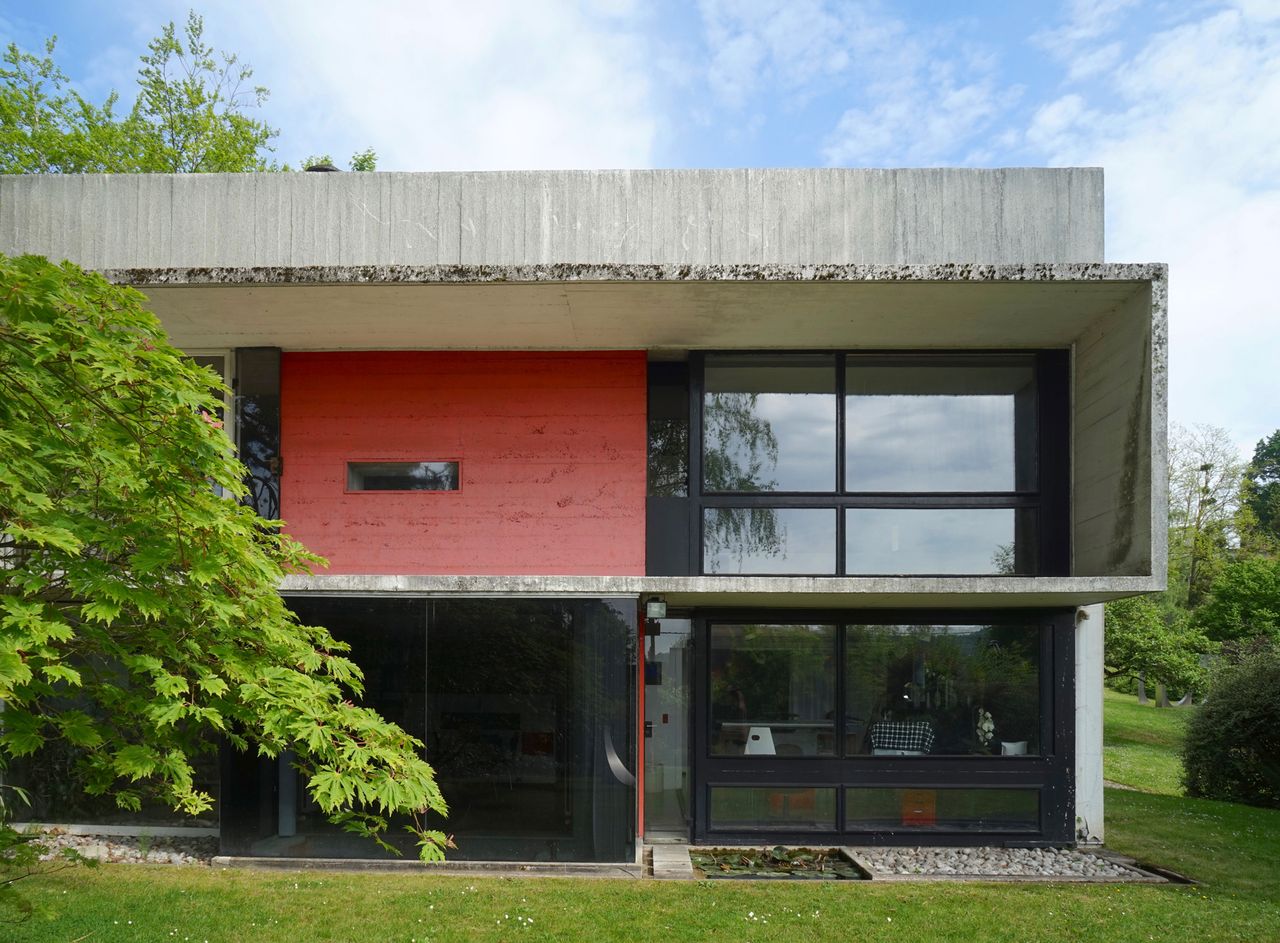 pan wogenscky house in france, a brutalist box with a red wall