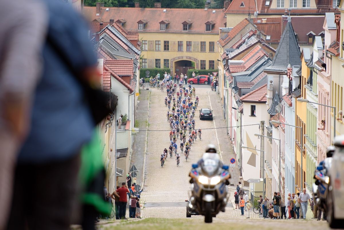 The peloton charge to the foot of the Meerane Wall cobbled climb at Th&uuml;ringen Rundfarht 2016 - Stage 3