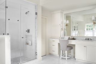 built-in makeup counter in marble bathroom by Evelyn Pierce