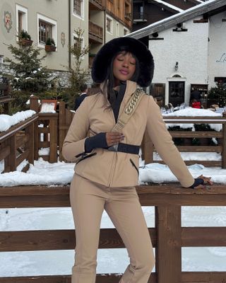 Emmanuelle Koffi posing at a lodge after going skiing.