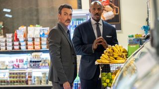 Reid Scott as Det. Vincent Riley and Mehcad Brooks as Det. Jalen Shaw in a store in Law & Order season 24 