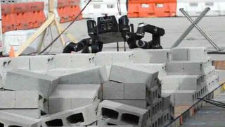 NASA's dexterous four-legged RoboSimian robot is seen during DARPA's Robot Challenge for disaster-response robots in December 2013.