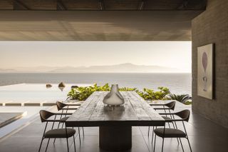 bridget house, a residence open towards sea views via glazed facade and metal structure framing the openings out to the sea